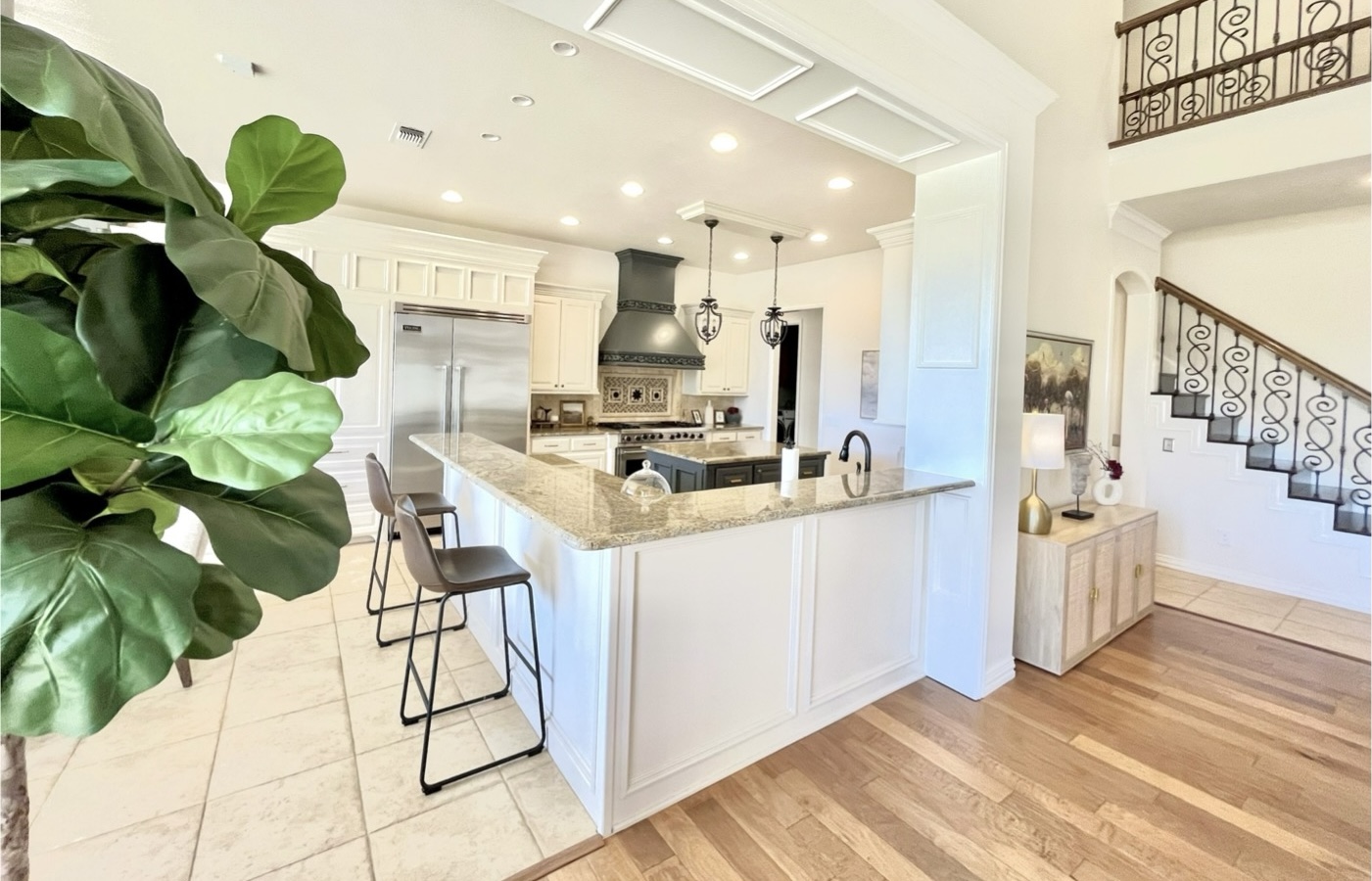 Kitchen with white painted cabinets by Top Coat Painting