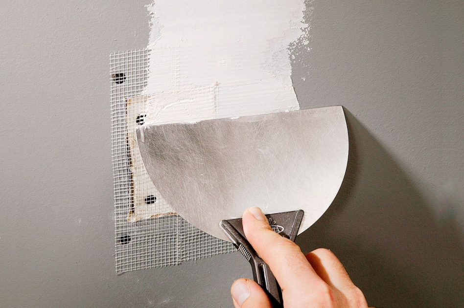 Drywall repair and patching on interior wall