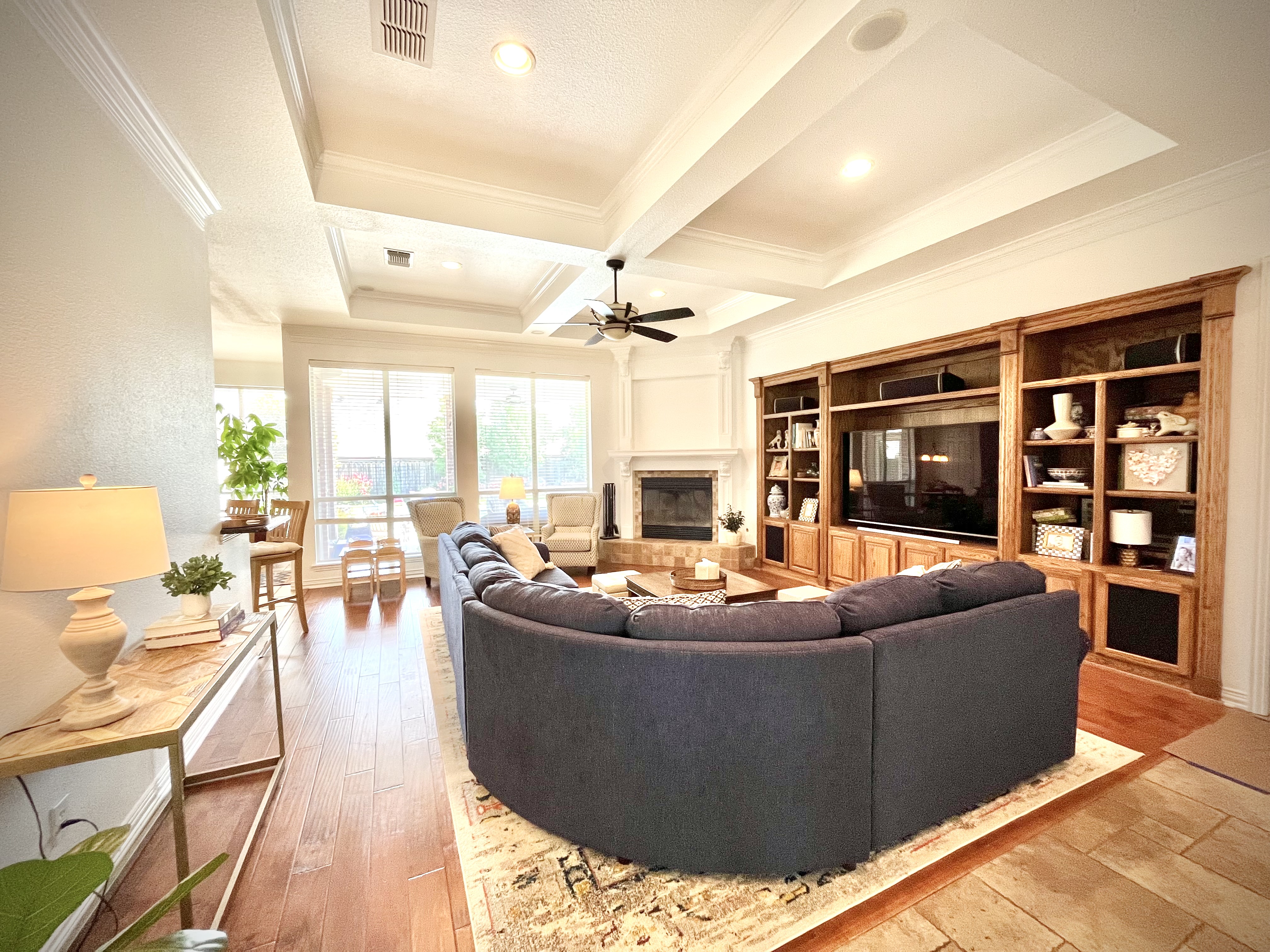 Elegant living room with coffered ceiling painted by Top Coat